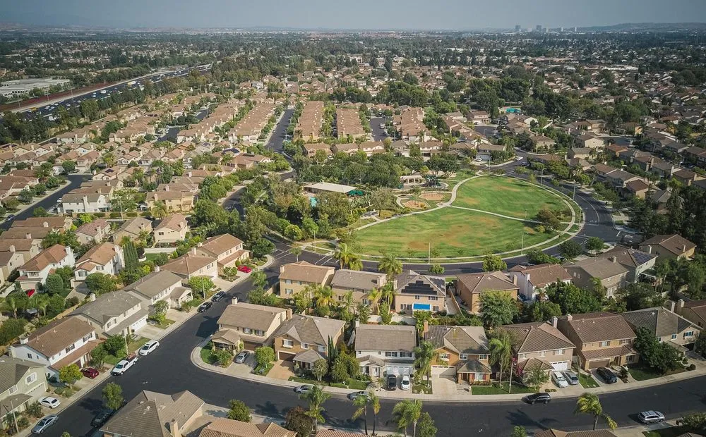 Aerial view of a suburban neighborhood showing residential streets and rooftops